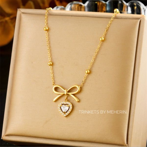 Zircon stone bow pendant