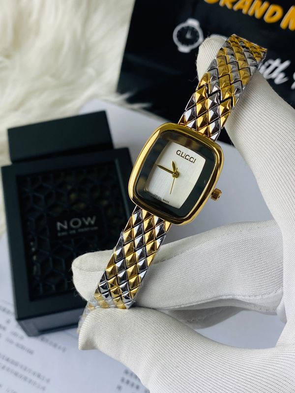 Two-tone Gucci watch with a square case and a patterned bracelet