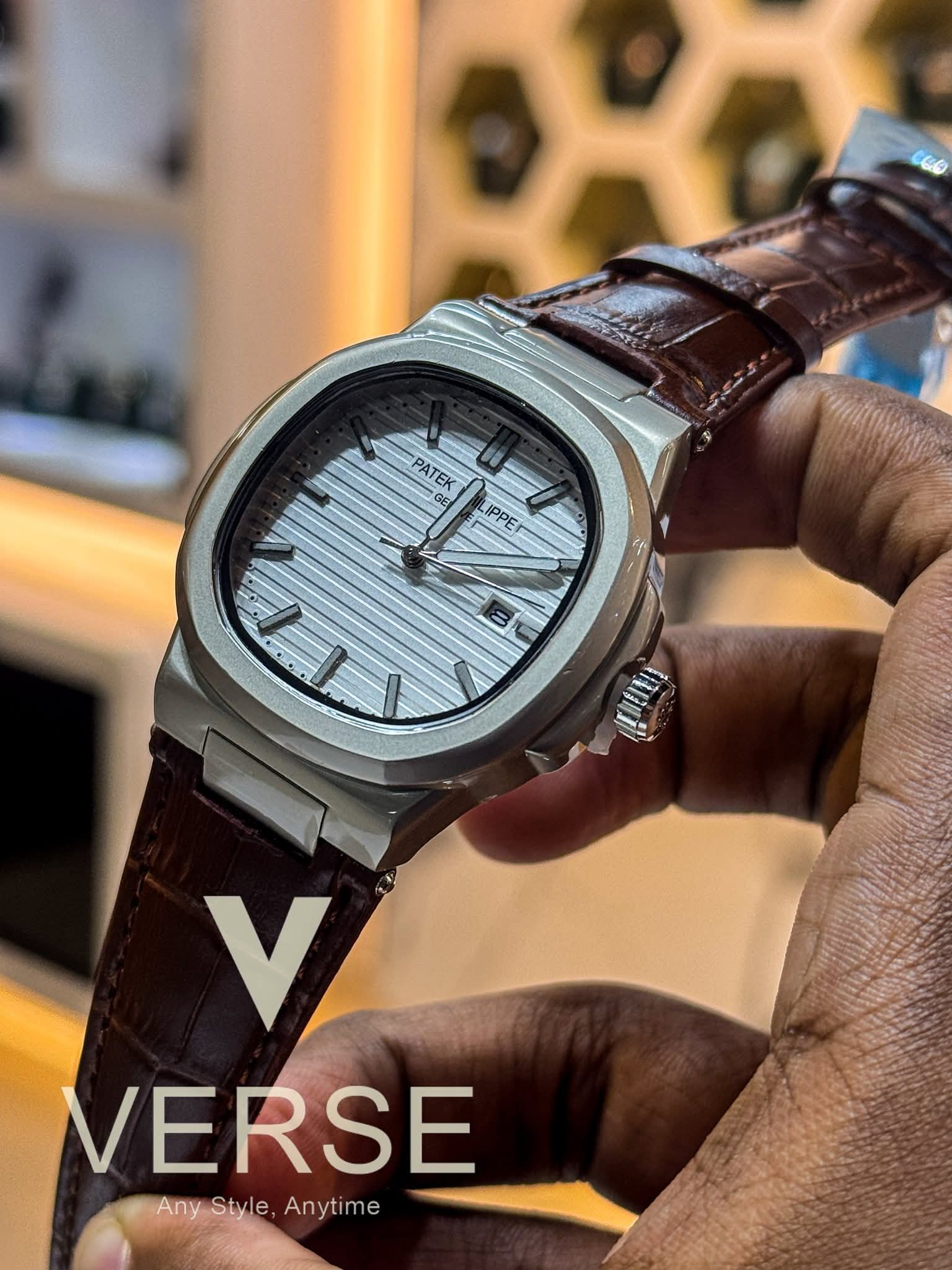 Patek Nautilus dial brown belt white dial sweep