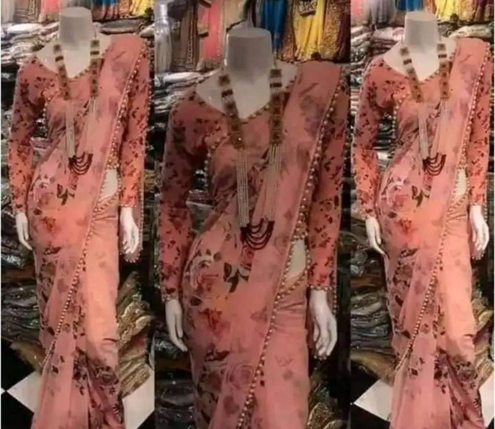 এক্সক্লুসিভ ডিজাইনের গোলাপী রঙের জর্জেট প্রিন্টেড পার্ল লেইস শাড়ির সাথে ম্যাচিং ব্লাউজ পিস সেট ড্রেস