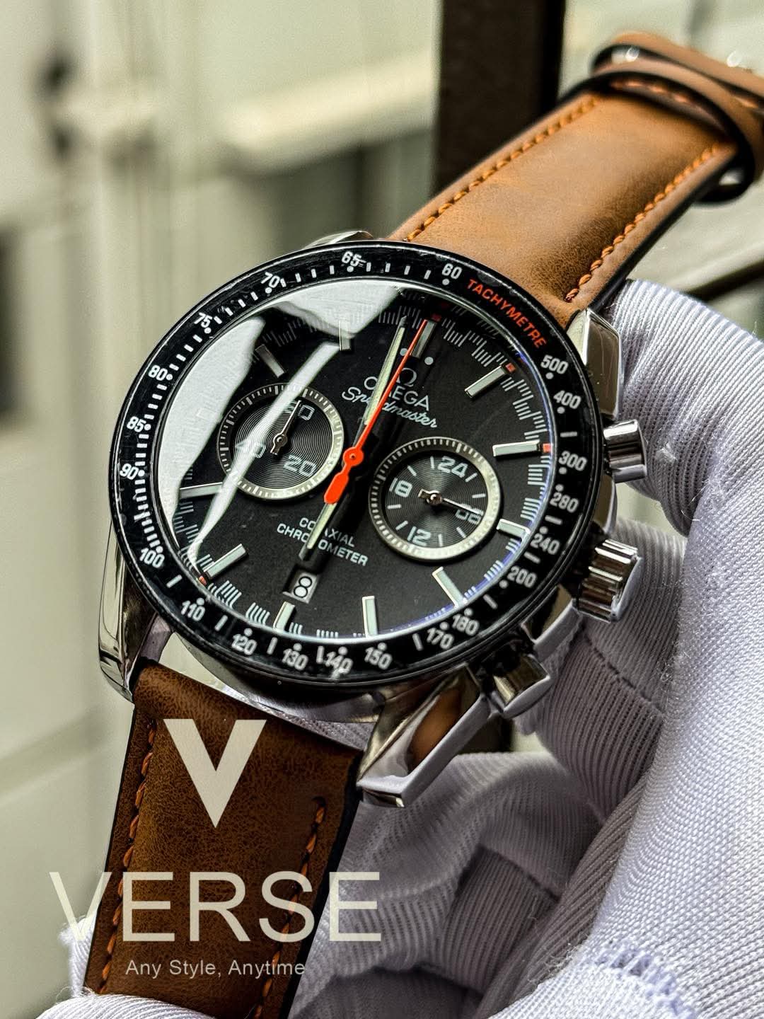 Omega Speedmaster light brown belt red hand