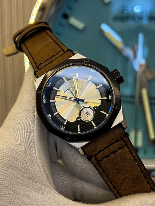 tubular chocolate belt round dial silver