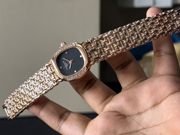 PATEK PHILIPPE STONE CASE ROSE GOLD BLACK DIAL