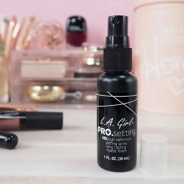 la girl setting spray