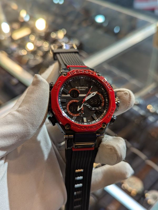 G Shock bulky black belt black dial red bezel