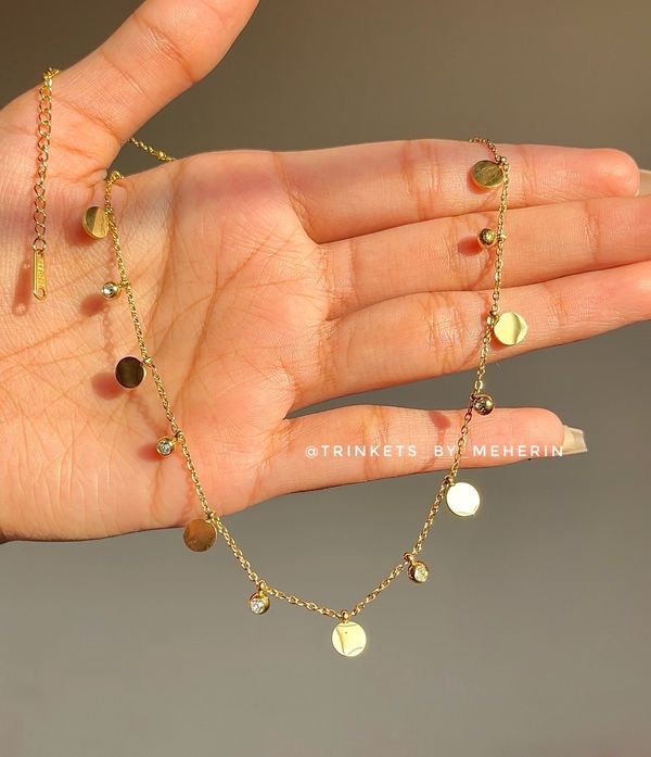Coin charm neckpiece